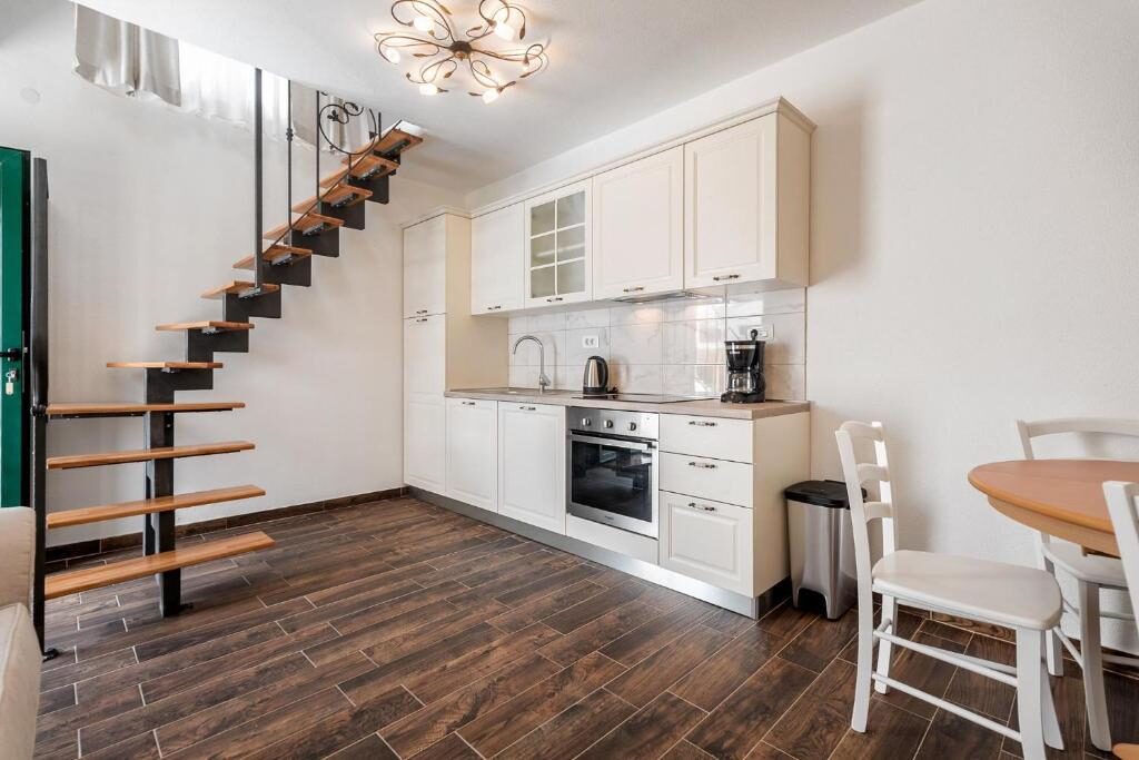 Apartment kitchen and dining area at Villa Trau d`oro